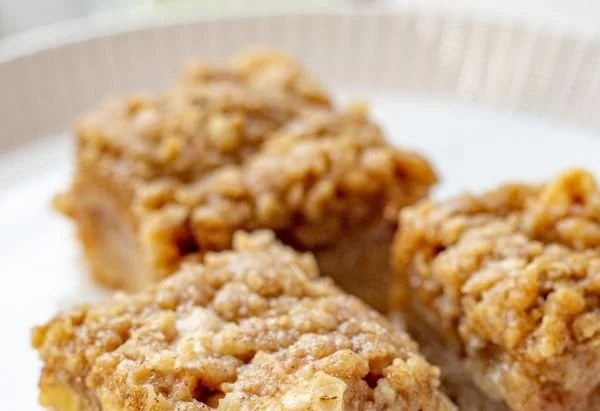 Delicious Apple Pie Bars with Streusel Topping served on a plate