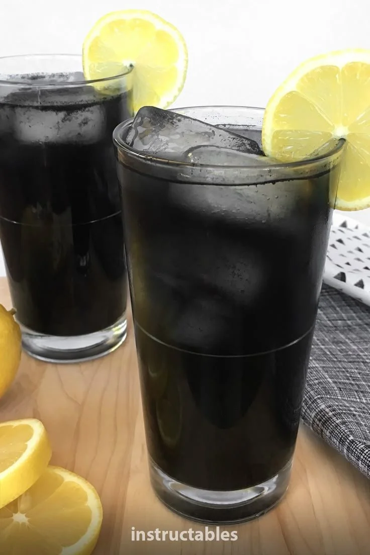 Refreshing Black Lemonade drink with lemon and activated charcoal