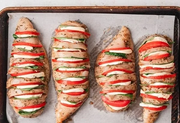Delicious Caprese Stuffed Chicken with fresh basil and mozzarella cheese