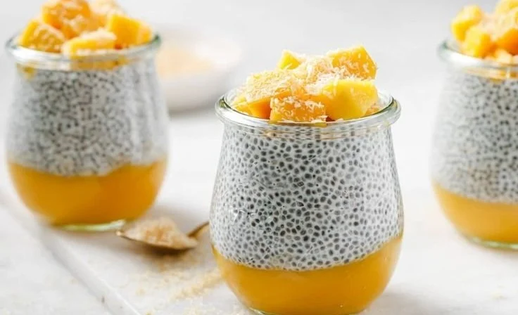 Chia seed pudding made with coconut milk and topped with fresh mango slices