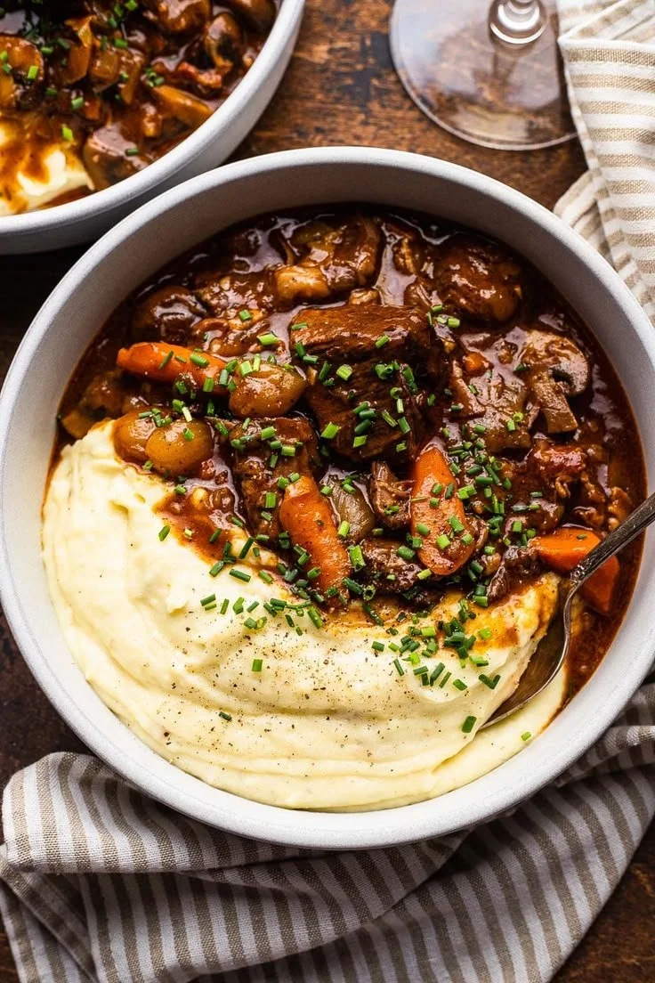 Delicious Beef Bourguignon served with mushrooms and herbs in a cozy setting