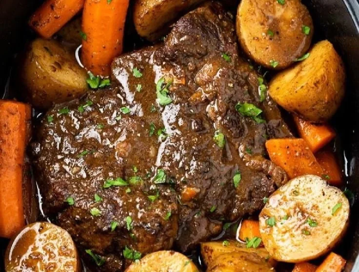 Delicious Crock Pot pot roast served with vegetables on a plate