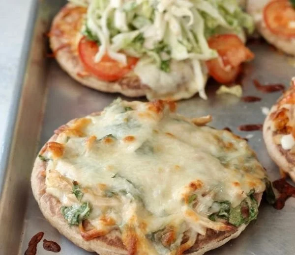 Easiest pita pizzas topped with fresh vegetables and cheese