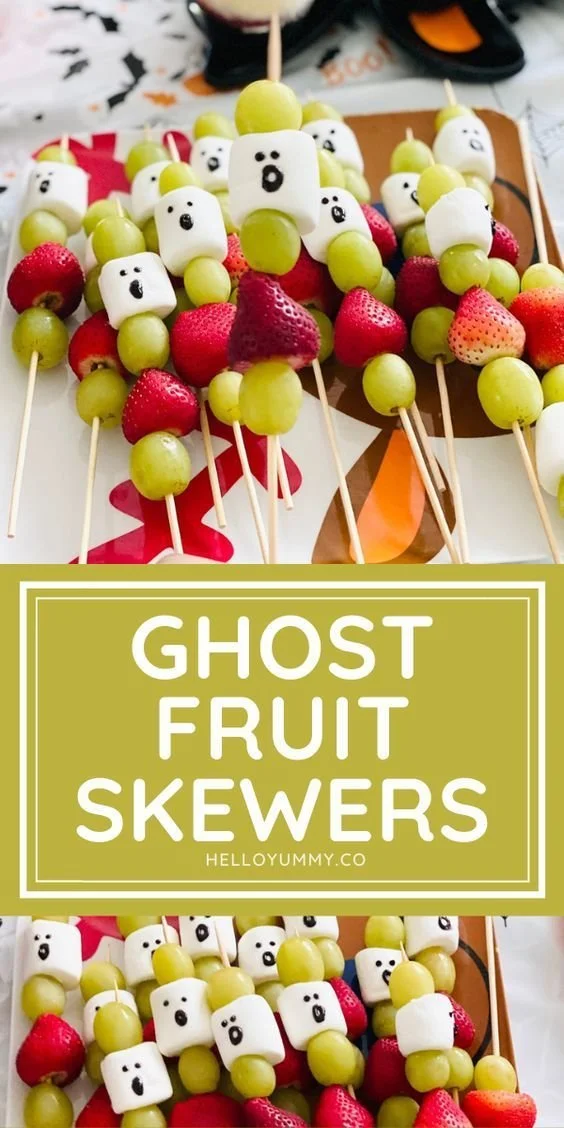 Ghostly fruit skewers decorated for Halloween festivities.