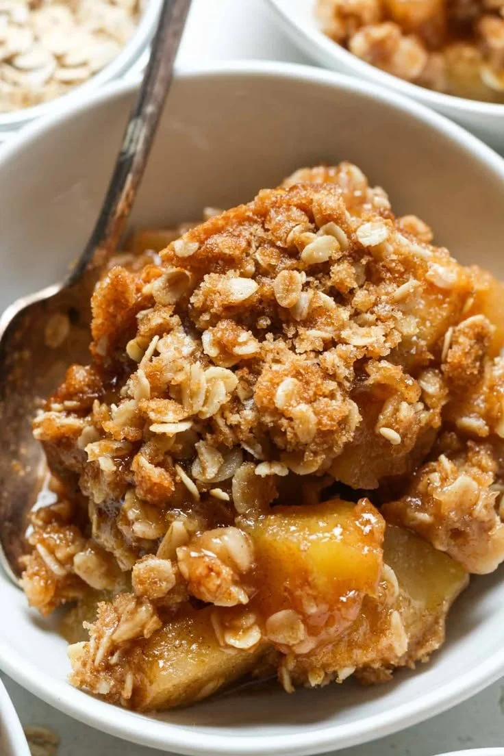 Delicious gluten-free apple crisp served with a scoop of vanilla ice cream