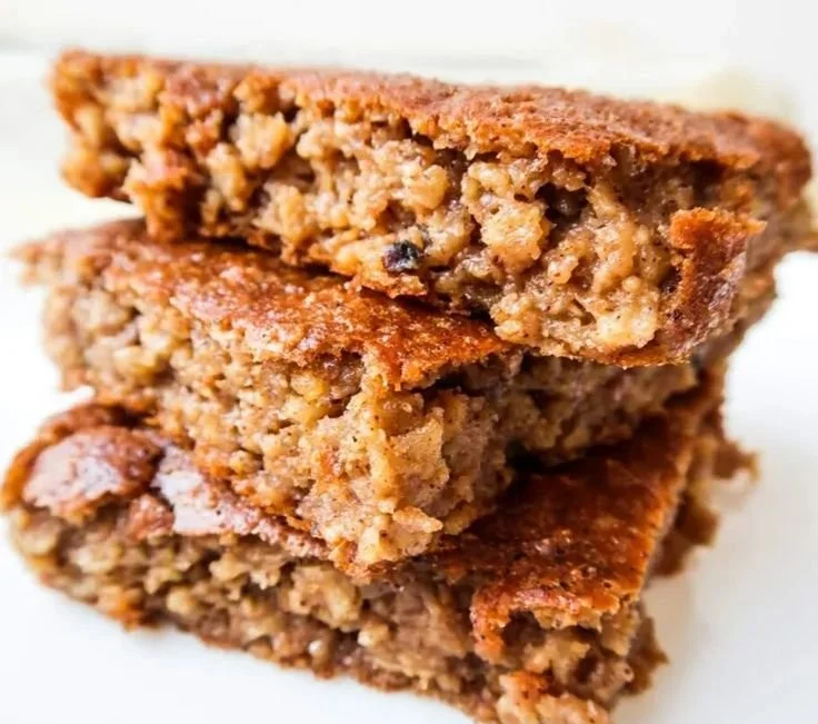 Gluten-free apple pear spice cake topped with cinnamon and nuts.