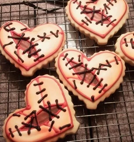 Gothic heart patch cookies decorated with intricate designs