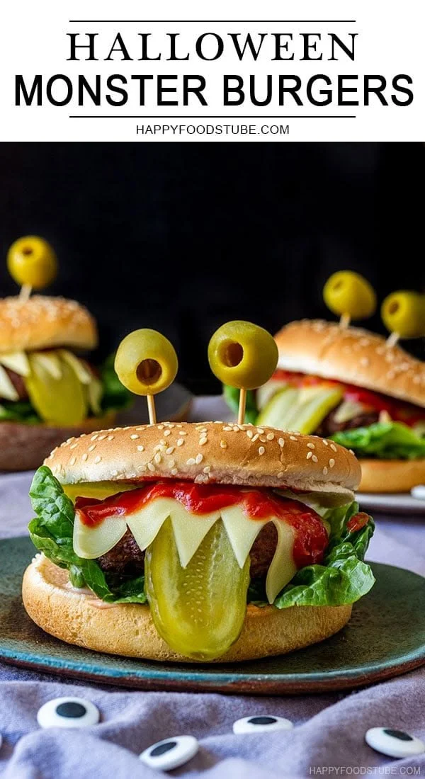 A spooky Halloween monster burger decorated with edible eyes and colorful toppings.
