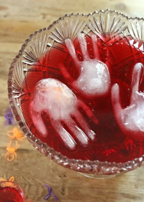 A spooky haunted punch recipe for Halloween parties with eerie decorations.
