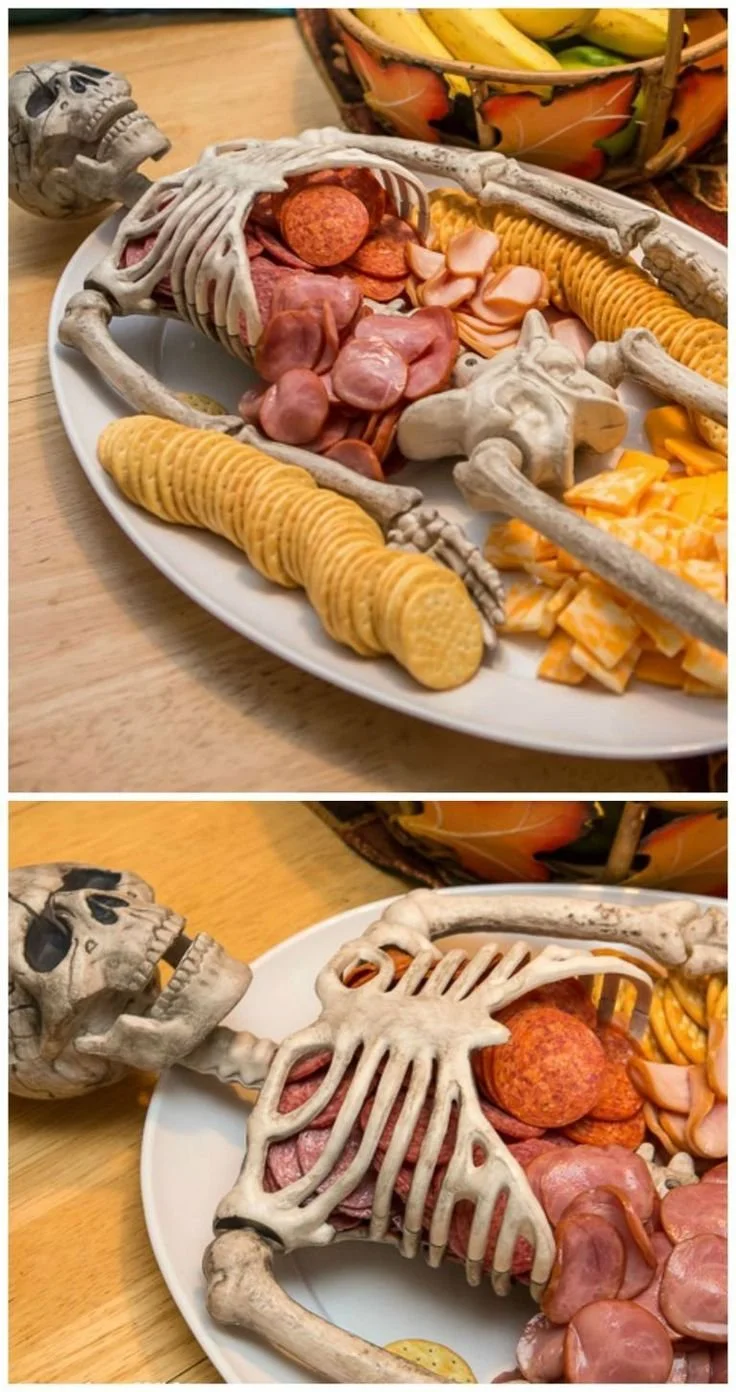 A variety of spooky Halloween snacks displayed on a festive table.