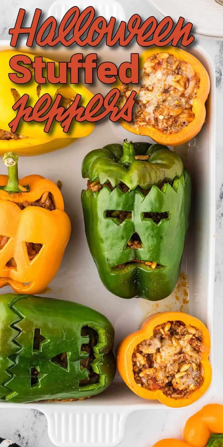 Colorful Halloween stuffed peppers filled with savory ingredients on a spooky-themed table