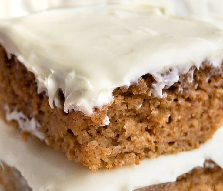 Slice of healthy applesauce cake served on a plate with a fork