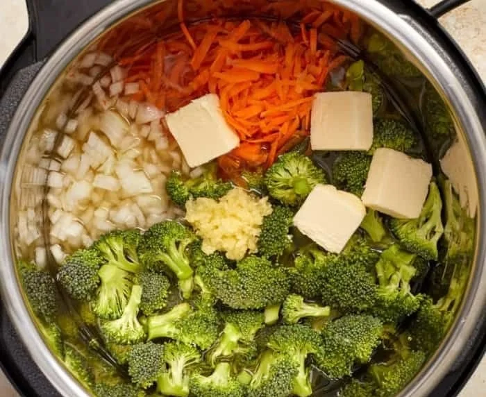 A bowl of creamy Instant Pot broccoli cheddar soup garnished with croutons.