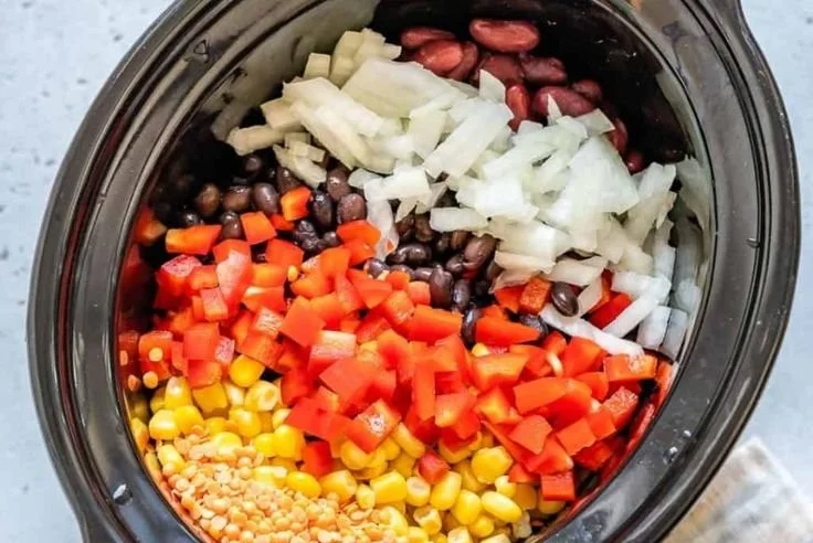 Bowl of delicious lentil tortilla soup with fresh toppings