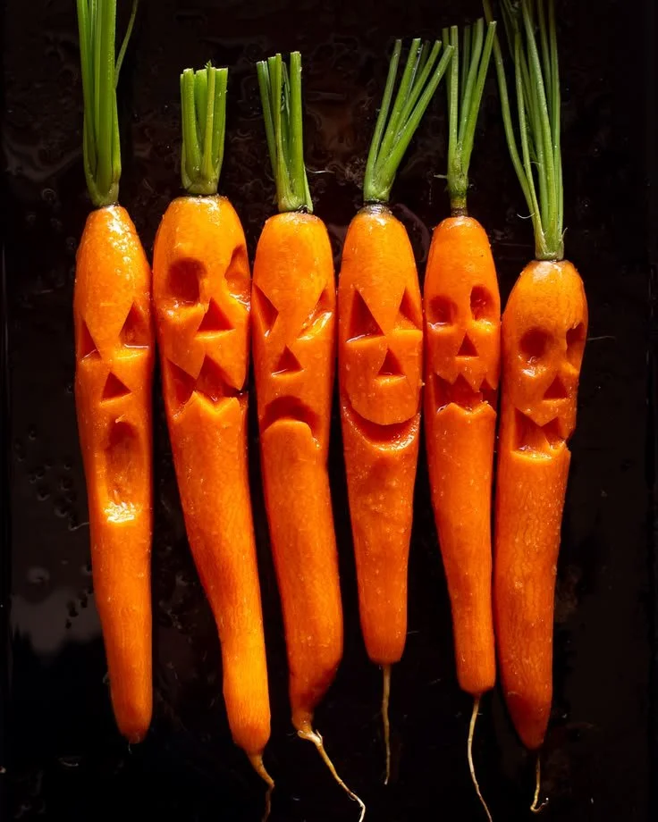Roasted carrots with chocolate balsamic sauce on a serving plate
