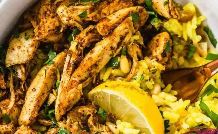 Delicious slow cooker chicken shawarma served with fresh vegetables and sauce