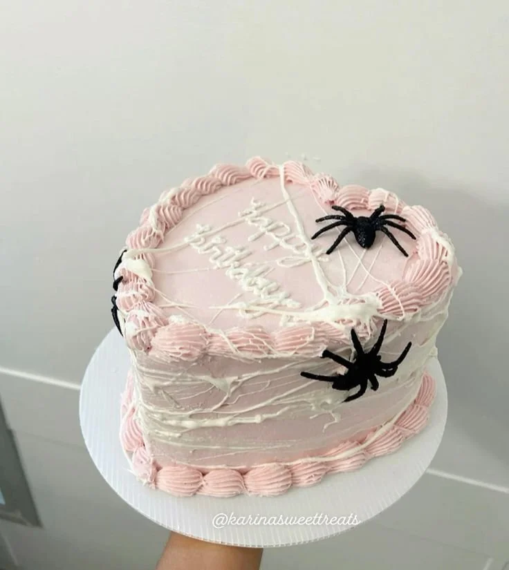 Spooky heart cake decorated for Halloween with fun designs and flavors